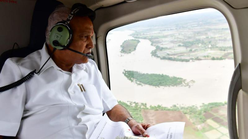 Karnataka CM Yediyurappa conducts aerial survey of flood-hit region