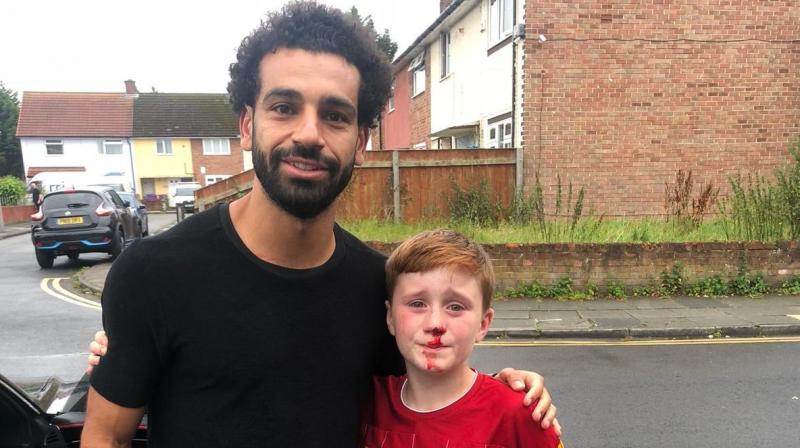 Salah comforts star-struck Liverpool fan who injured nose