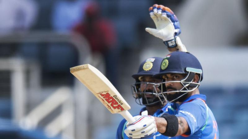 Dinesh Karthik (Left), who is making a return to the 50-overs side for the ODIs against New Zealand after having last played in the series against West Indies in the Caribbean a few months ago, said he was happy to be back and hoped to do well if he got the opportunity.(Photo: AFP)