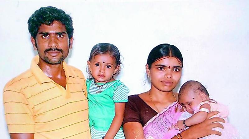 Shankar Naik and his wife Saritha with their two daughters Sridevi and Srinidhya.