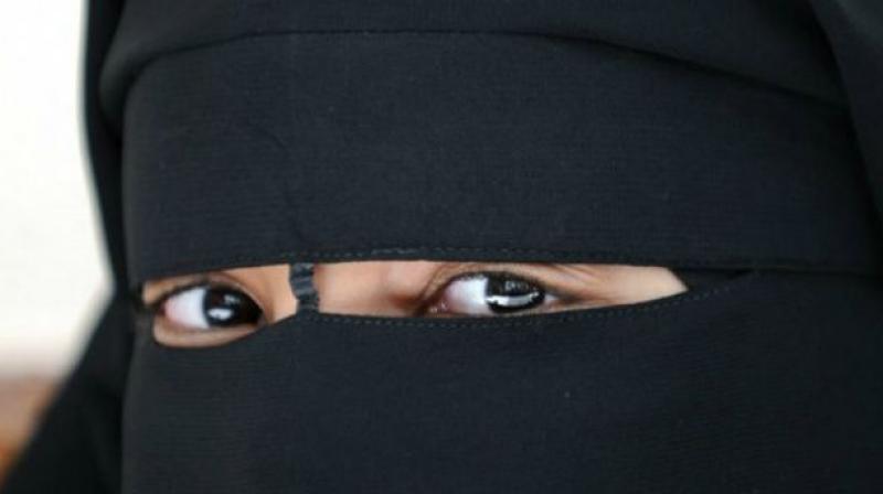 A post-graduate student used a burkha for cover as she went about stealing gold and silver ornaments, cash and other valuables from woman passengers in RTC buses.