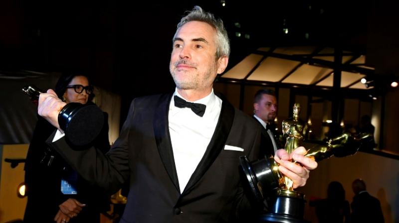 Alfonso Cuaron received three Oscars in 2019 for \Roma,\ a Netflix movie. (Photo: AFP)