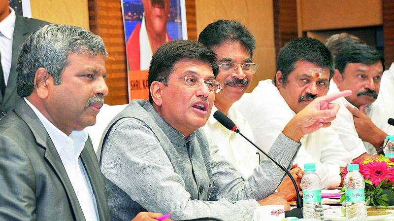 Union power minister Piyush Goyal addresses during discussion on GST at a hotel in Visakhapatnam on Wednesday. (Photo: DC)