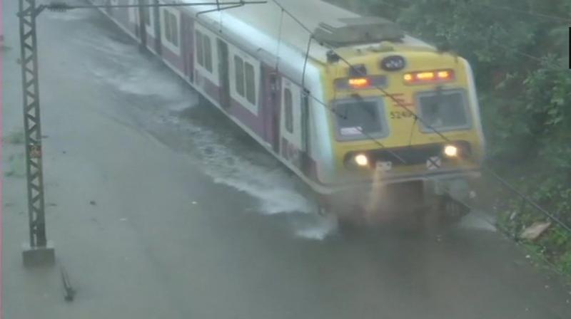 In multiple tweets, the Western Railway said that some trains in the Mumbai-Valsad-Surat section have been cancelled due to water-logging in Palghar section. (Photo: ANI | Twitter)