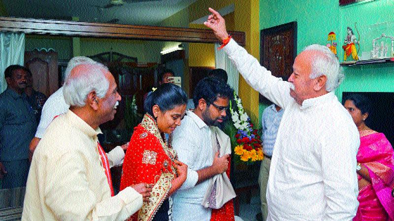 RSS chief Mohan Bhagwat blesses Vijaya Laxmi and Dr Jignesh at the residence of Union minister Bandaru Dattatreya in Hyderabad on Tuesday.