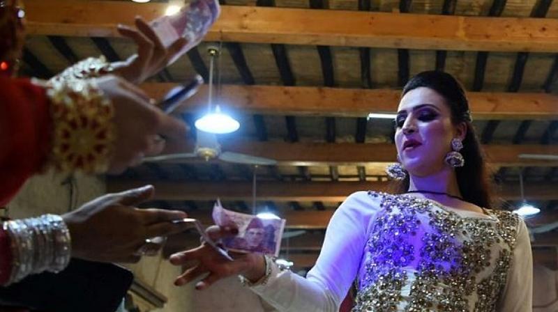 Many of Pakistans transgender people earn their living by being called upon for rituals such as blessing newborns or to bring life to weddings and parties as dancers.(Photo: AFP)