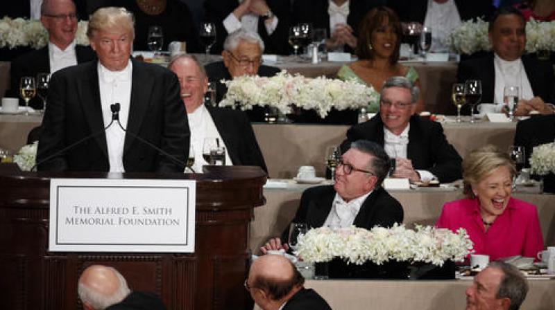 Democratic presidential candidate Hillary Clinton, right, reacts as Republican presidential candidate Donald Trump speaks during the Alfred E. Smith Memorial Foundation dinner. (Photo: AP)
