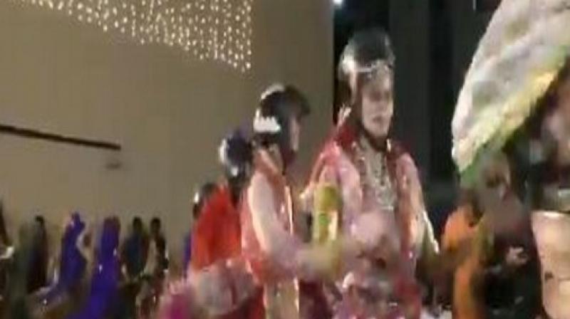 Surat: Dance group performs Garba wearing helmets to create road safety awareness