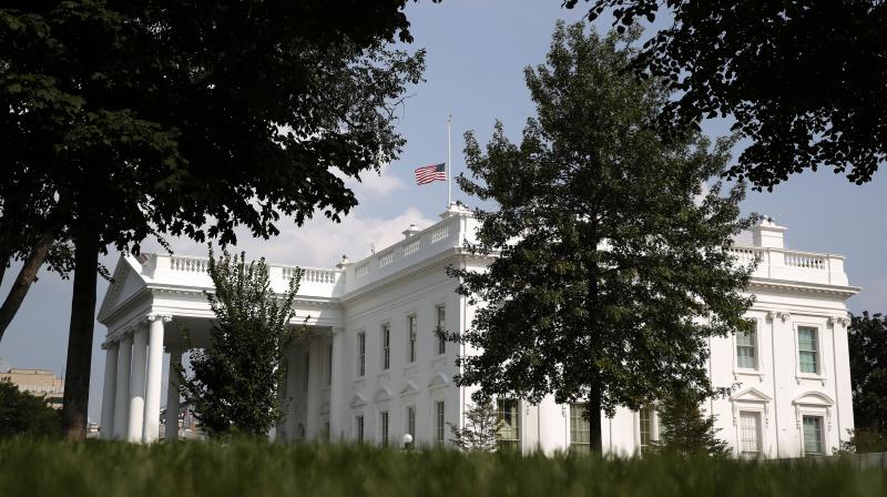 The White House flag was lowered after McCains death on Saturday -- but it was once again at the top of the flagpole on Monday morning. (Photo: AP)