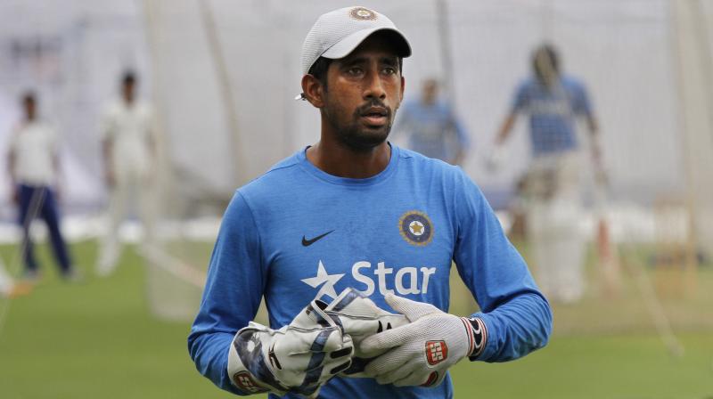 \Wriddhiman Saha has sustained a posterosuperior labral tear. He will undergo surgery on his shoulder in Manchester at the end of July or the 1st week of August,\ said BCCI. (Photo: AP)