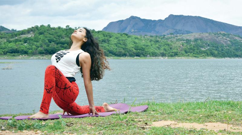 Namita Kulkarni, a yoga practitioner demonstrates an asana