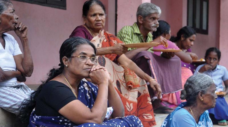 Worried residents at a rehabilitation camp at St. Marys High School after they were forced to abandon homes. (Photo: SUNOJ NINAN MATHEW)