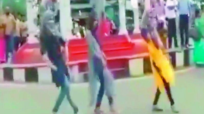 Video grab of the three Muslim girls dancing at a junction on a highway in in Malappuram. 	 Via web