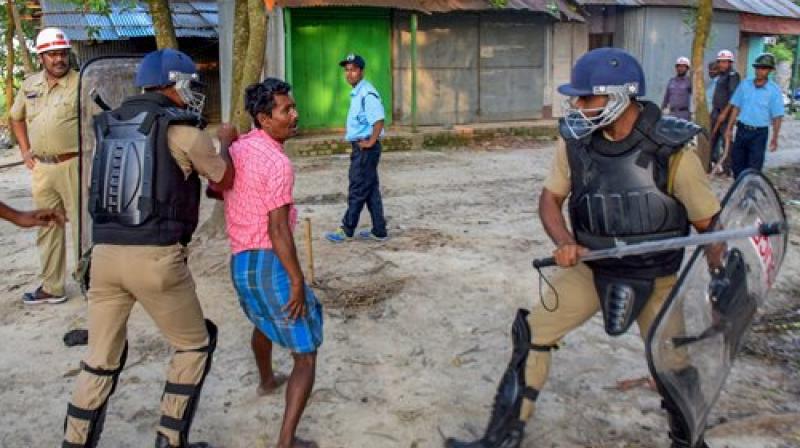 Security personnel lathi charge on political party workers who were allegedly involved in ransacking a polling booth and public property during Panchayat elections, at Rampur of South Dinajpur district of West Bengal. (Photo: PTI)