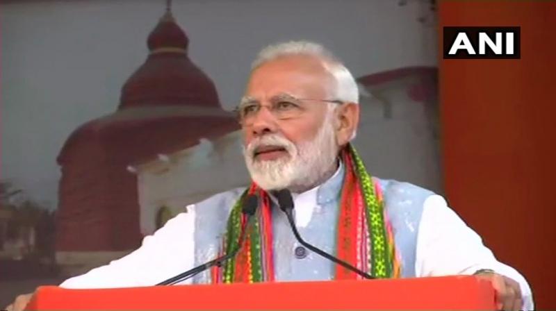 They are trying to form a majboor (weak) government in Delhi. They are worried about the present majboot (strong) government, said PM Modi at the rally in Agartala. (Photo: ANI)