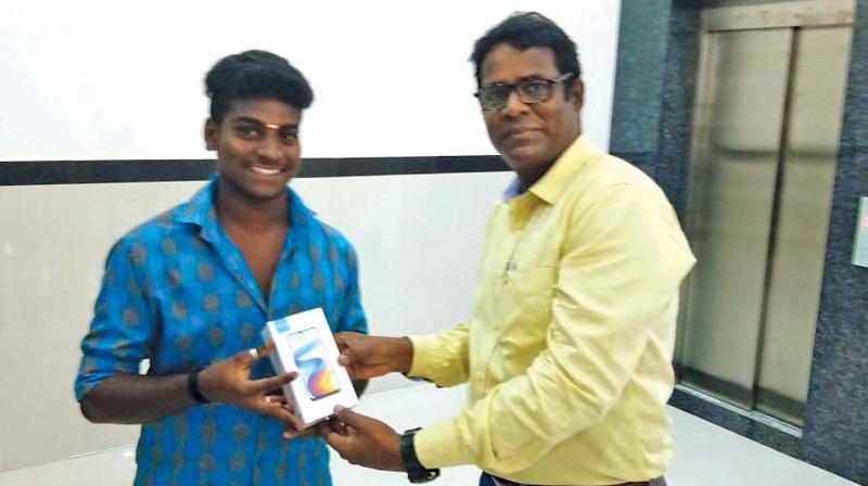 Sivakumar has gifted a new mobile phone to the youngster named Rahul from Madurai.