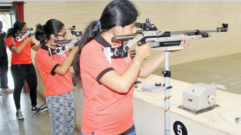 Kids practicing air rifle and pistol shooting at MRC in Wellington during the summer adventure camp. (Photo: DC)