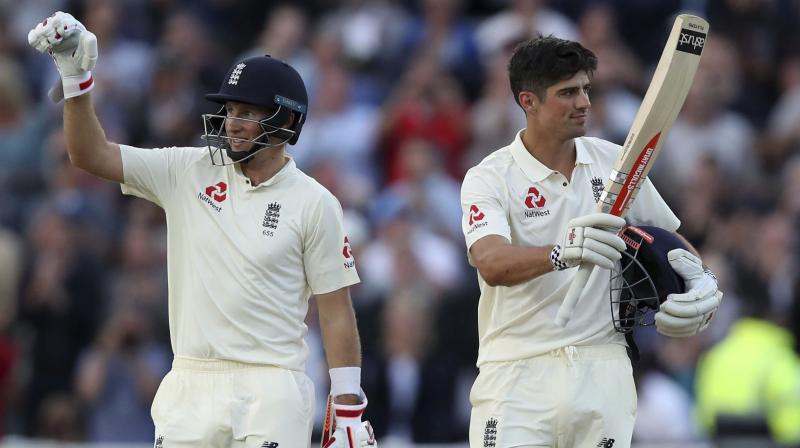 The current and former skipper embraced when Root got his century, and Root then celebrated for his teammate, arms waving in the air, as he ran through for the single that took Cook to three figures. (Photo: AP)