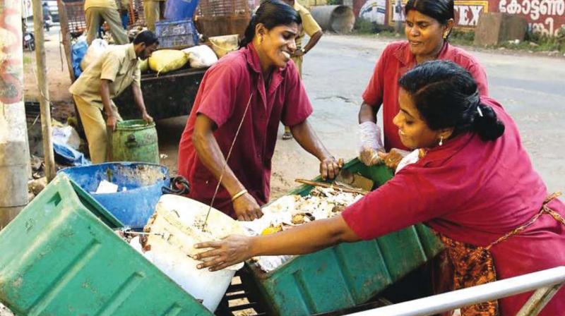 Kudumbashree workers engaged in collecting waste. FILE