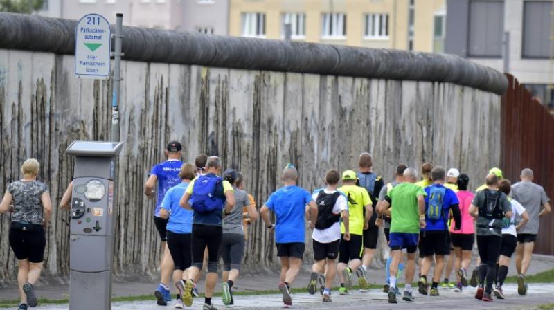 500 runners from 32 nations to race along Berlin wall in tribute to victims