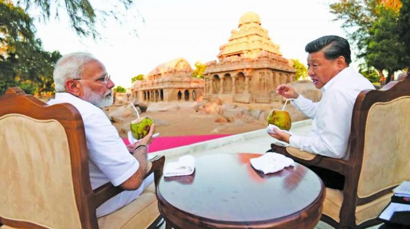 Xi savours the menu, Modi cleans up after