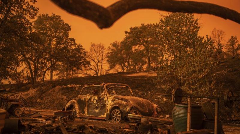 Cars scorched by the Carr Fire rest at a residence in Redding, California on July 27. (Photo: AP)