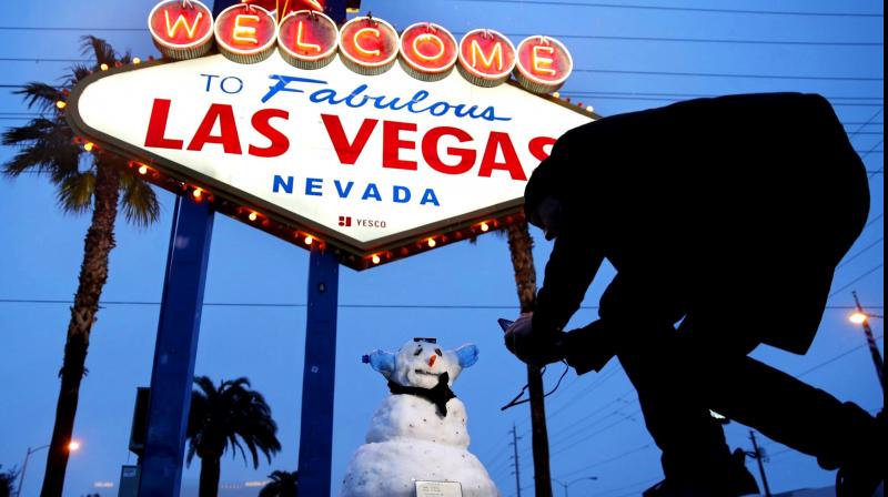 The rare snowfall at the lower levels of Nevada prompted revellers to erect a snowman near the famous  Welcome to Fabulous Las Vegas  sign. (Photo: AP)