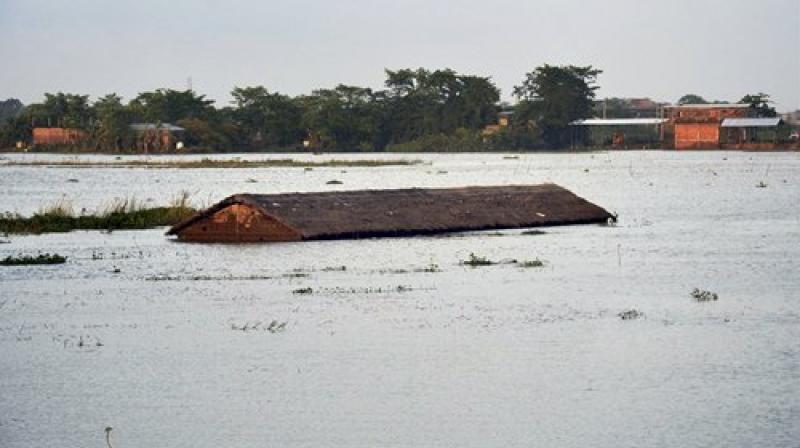 An inundated village at Suprakandhi in flood-hit Karimganj district of Assam on Sunday July 30. (Photo: PTI)