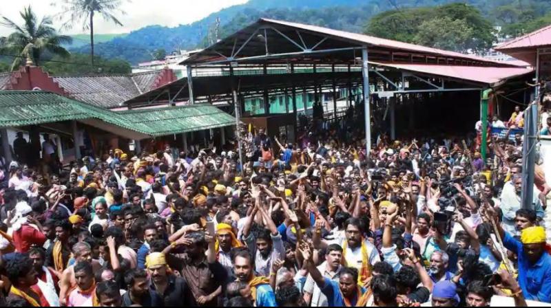 Protests erupted in Sabarimala temple in Keralas Pathanamthitta on Tuesday after a woman reached near the 18 holy steps of the hilltop shrine and agitators heckled her over her age. (Photo: PTI)