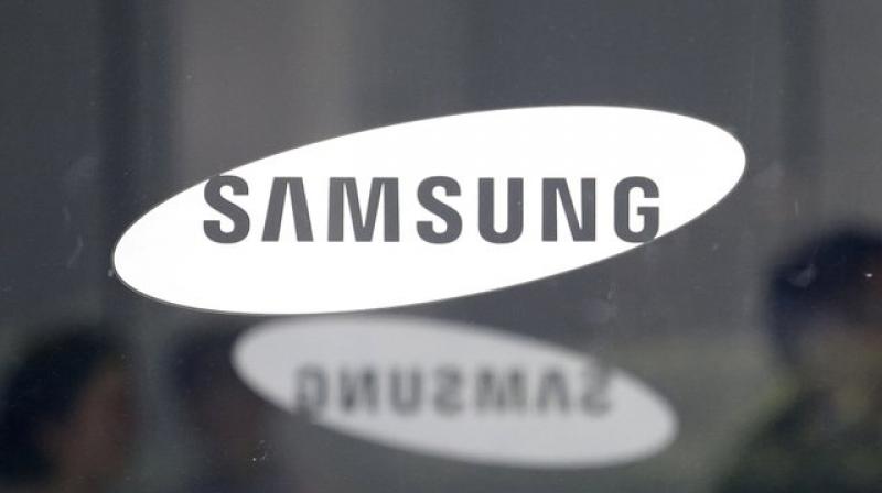 Samsung Electronics take hit, one-off gains to beat expectations