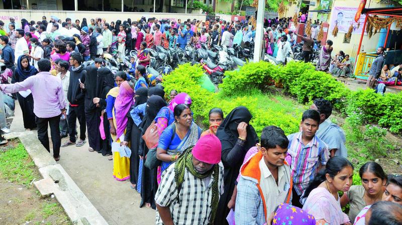 As seasonal fevers grip the city, long queues of people are seen at the Fever Hospital, Nallakunta in Hyderabad on Tuesday, waiting to avail treatment. 	(Photo: P. Surendra)