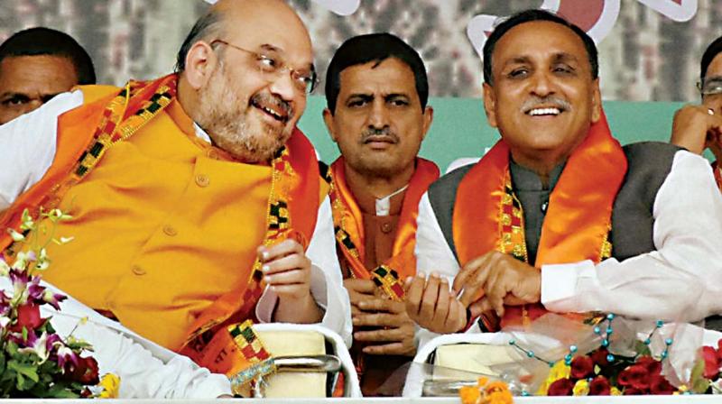 File photo of BJP president Amit Shah with Gujarat CM Vijay Rupani. The BJP nominated Rupani to contest from Rajkot West.