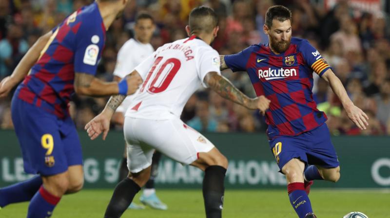 Lionel Messi scored his first goal of the season as Barcelona beat Sevilla 4-0 on Sunday to climb into second place in the La Liga standings behind Real Madrid. (Photo:AP)