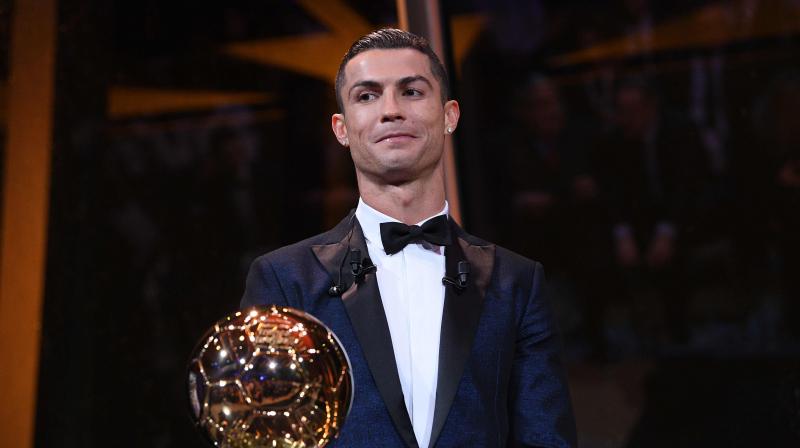 Cristiano Ronaldo was awarded the Ballon dOr for world player of the year on Thursday for a joint-record fifth time, going level with eternal rival and Barcelona forward Lionel Messi as the player to have won the prize the most times.(Photo: AFP)