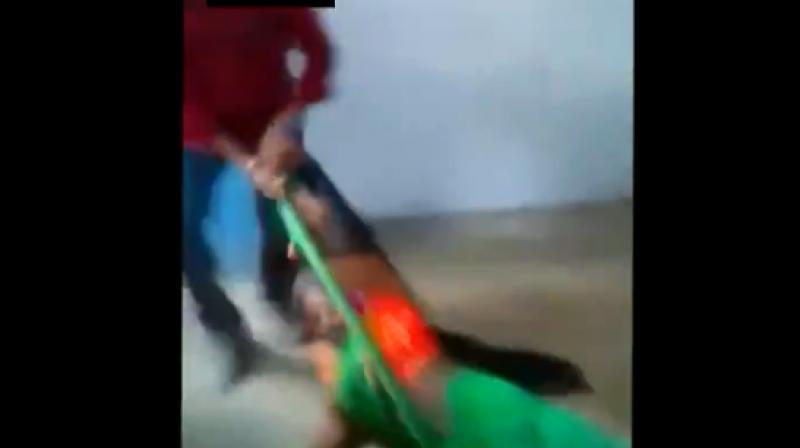 Watch: C\garh official suspended after her husband drags woman with 3-month-old baby