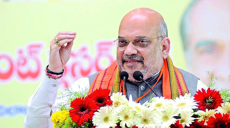 BJP president Amit Shah addresses the partys cluster meeting in Nizamabad on Wednesday.
