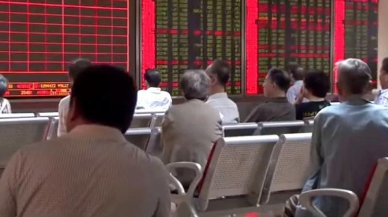 Japans Nikkei was flat after weaving in and out of the red. It looked set for a 0.3 per cent weekly loss as investors braced for upcoming earnings reports.