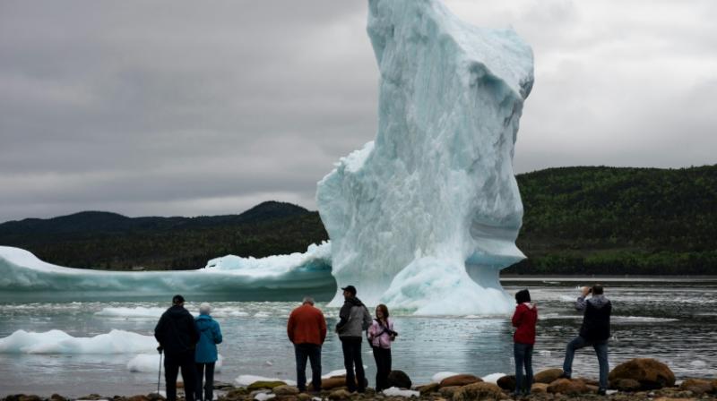 Spectacle of collapsing iceberg boosts tourism in Canada