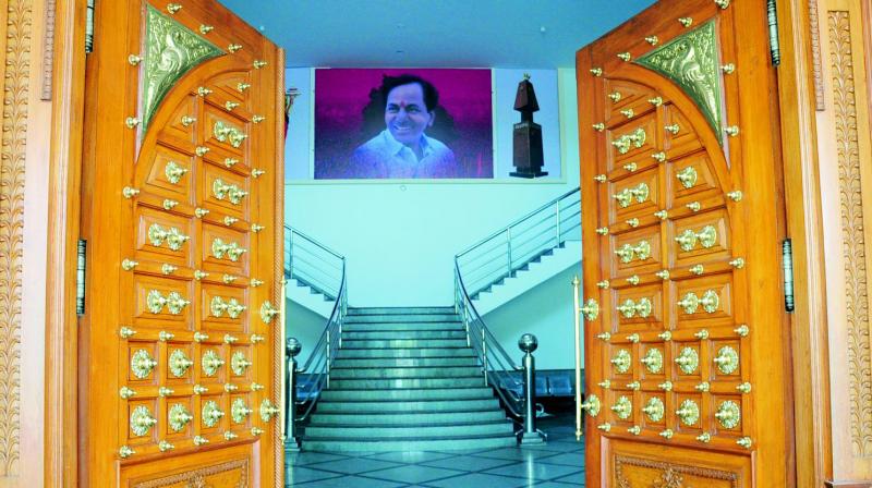 The entrance to the TRS Bhavan (above) opens to a portrait of party president and Chief Minister K. Chandrasekhar Rao.