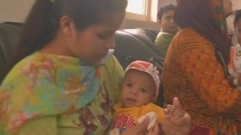 Appreciate EAM Sushma Swaraj, she helped me a lot, father of the infant Rohaan, who arrived in India for treatment said. (Photo: ANI/Twitter)