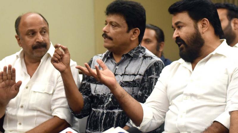 AMMA president Mohanlal along with Jagadish and Siddique at the press meet after the executive committee meeting in Kochi on Friday. 	Image; Arun Chandrabose
