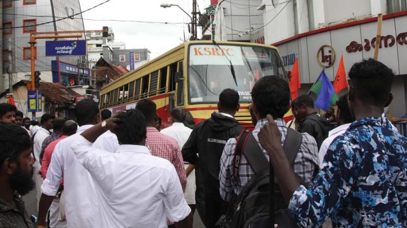 Hartal supporters block a KSRTC bus at Central Junction in Kottayam on Tuesday. (Photo: DC)