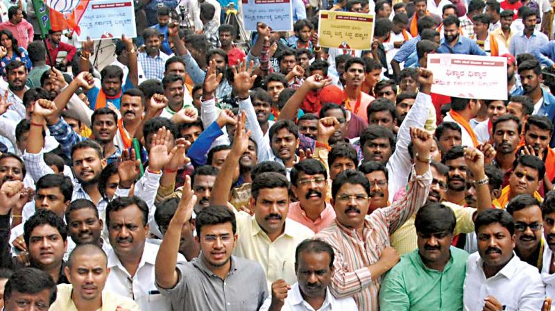 BJP workers hit the streets against land sale to Jindals