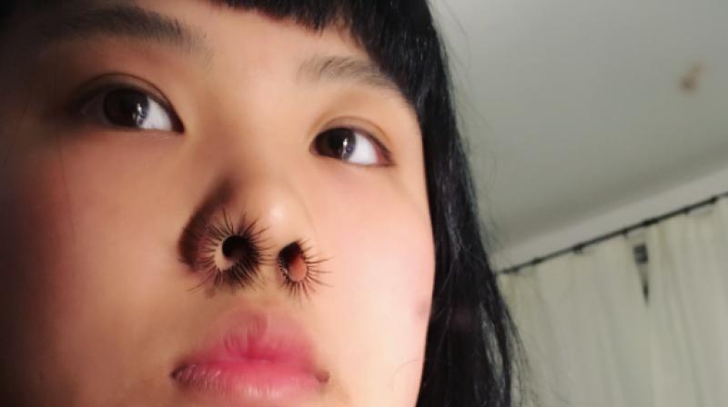 Nose hair extensions are the latest beauty trend. (Photo: Instagram / gret_chen_che)