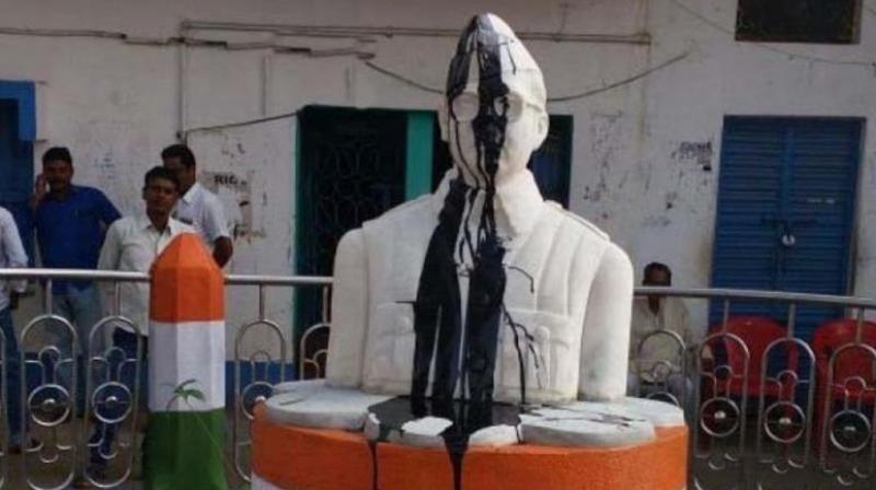 On Tuesday morning when the gate of the panchayat office was opened it was found that the statue was smeared with coal tar and face was partly damaged, the police said. (Photo: ANI/Twitter)