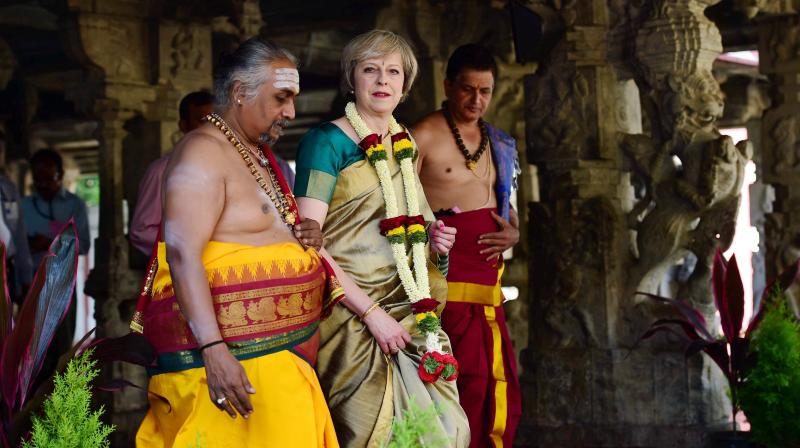British Prime Minister Theresa May, donning a saari, visits the Someshwara temple in Bengaluru on Tuesday. (Photo: PTI)