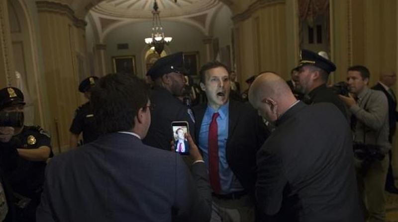 The protester was identified as Ryan Clayton, leader of a group called Americans Take Action. (Photo: AFP)