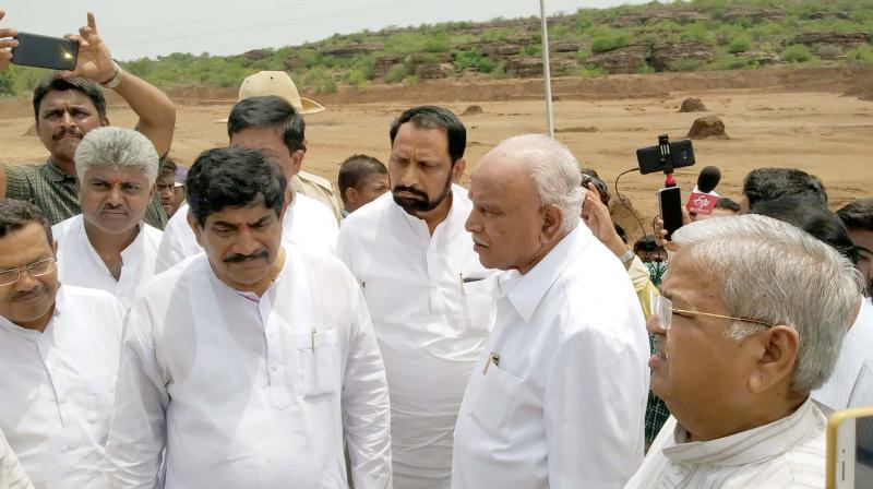 B.S. Yeddyurappa visits drought-hit areas in Bagalkote district. He was accompanied by party leaders including Bagalkote BJP MP Gaddigoudar.