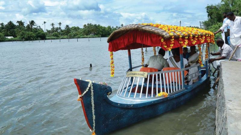 The shikara boat that can accommodate up to ten people being readied at Kakkathuruth. 	DC