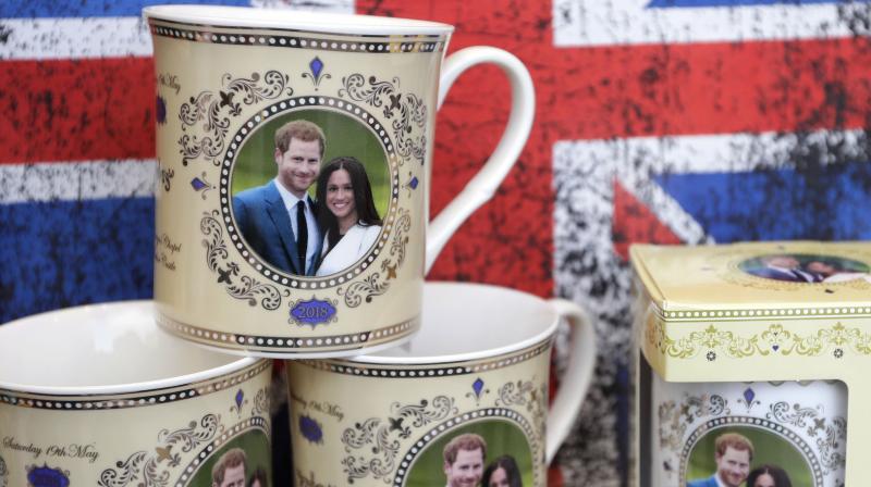 Mugs with the image of Britains Prince Harry and Meghan Markle are seen displayed for sale in a shop window in Windsor, England, Thursday, March 29, 2018. (Photo: AP)